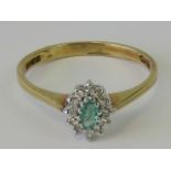 A 9ct gold emerald and white stone ring,