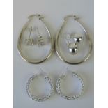 Four pairs of earrings, two pairs of hoop earrings each stamped 925,