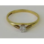 An 18ct gold platinum and diamond solitaire ring, round brilliant cut diamond approx 0.