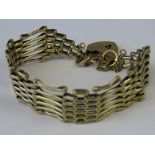 A 9ct gold six bar gate bracelet, hallmarked 375 with heart padlock clasp hallmarked 375, 19g.