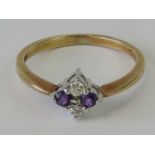 A 9ct gold diamond and amethyst ring,