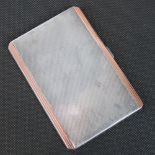 A HM silver cigarette case with rose metal (probably 9ct gold) border, gilt interior,