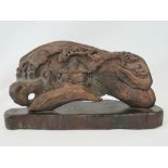 A late 19th century, Chinese carved camphor wood scene featuring a musician playing a guzheng,