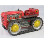A vintage clockwork tin plate bulldozer 'Diesel 12' with rubber tracks,