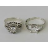 Two silver rings; one Art Deco stepped design set with graduated white stones, size R,