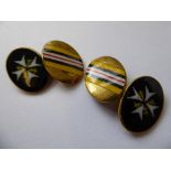 A cased pair of enamelled yellow metal St. Johns Ambulance cufflinks, marked "LsP". 9g.