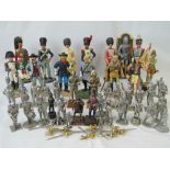 A quantity of 20th century composite and die-cast metal military figures featuring different