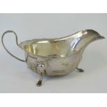 A HM silver sauce boat with pie crust edge and three feet, Sheffield 1932 - Viners Ltd, 3.42ozt.