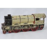 A vintage clockwork tinplate 'locomotive' by Wells of London and measuring 25cm in length.