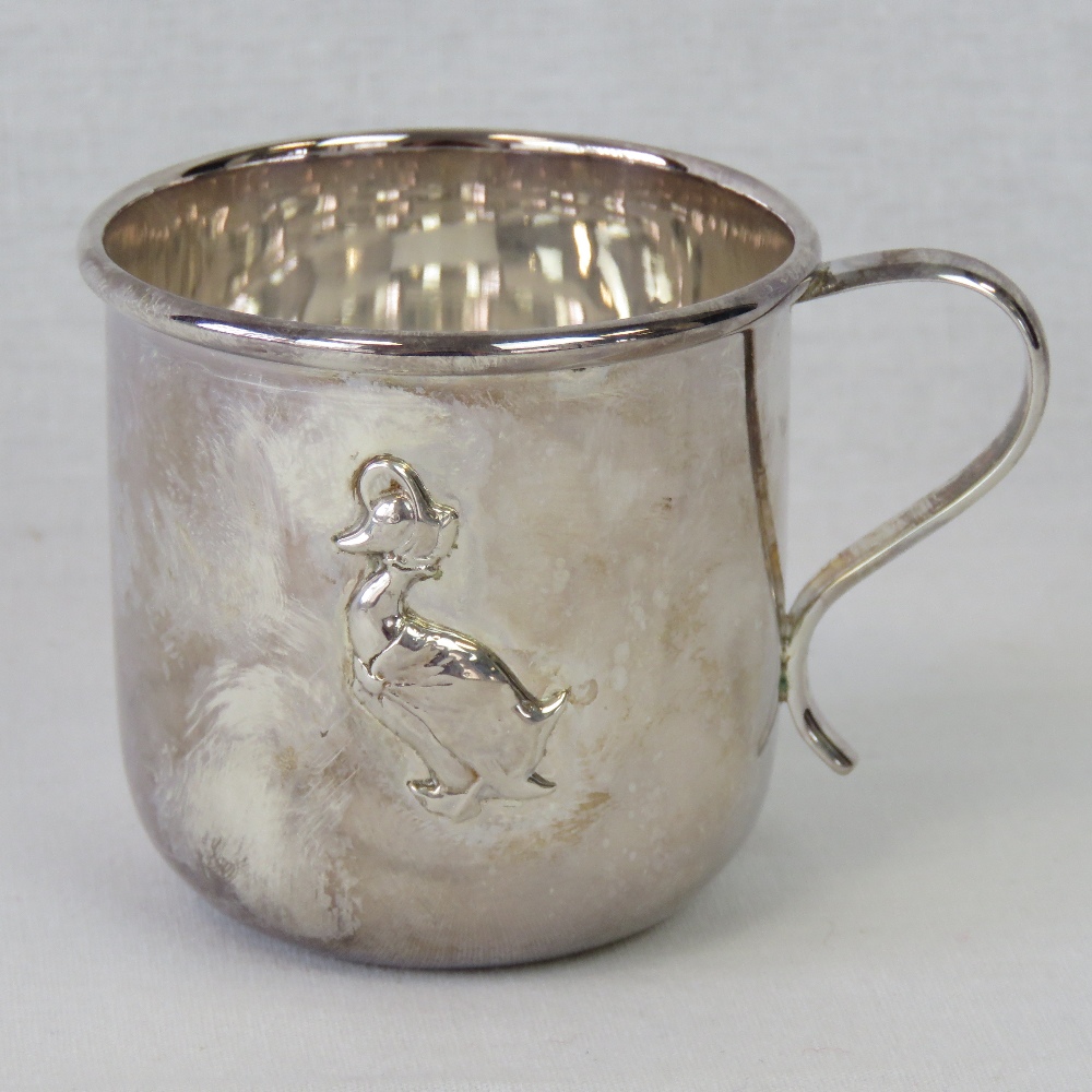 An HM silver Beatrix Potter Christening mug decorated with repoussé Jemima Puddleduck; 2.9ozt.