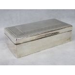 A HM silver cigarette box with cedarwood lining, London 1937 - makers mark worn, 18 x 9.5 x 6cm.