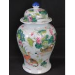 A large late 19th/ early 20th century lidded vase decorated with wild geese and lotus flowers upon