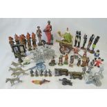 Five die cast metal canons of various sizes together an assortment of ethnic wooden figures and