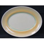 A Clarice Cliff meat plate, yellow ground, 36.7cm wide, some small scratches to paint.