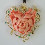 A large and impressive carved coral pendant with diamond and emerald set 18ct gold vine, leaf,