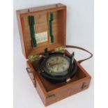 A vintage mahogany cased 1945 “Patt 42 Bearing plate”; 16cm diameter; case stamped “30 April 1945”.