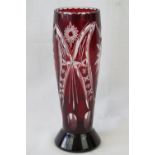 A Bohemian cut cranberry to clear overlay glass vase, 27cm.