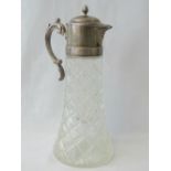 A large pressed glass claret jug with plated top and handle, surmounted by acorn finial, 35cm high.