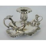 A Victorian white metal chamberstick complete with candle snuffer attachment, vine leaf design, 2.