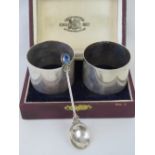 A cased pair of silver napkin rings, made by P. Orr and Sons, stamped Sil with makers mark, 1.74ozt.