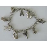 A Sterling silver charm bracelet with heart padlock clasp,
