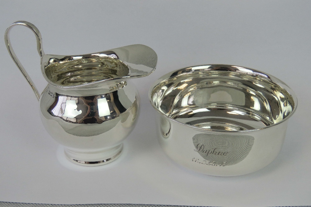 A HM silver cream jug, London 1902, and a sugar bowl, Birmingham 1915, engraved 'Daphne 10 Dec 17',