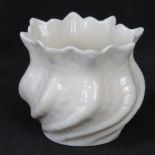 A Belleek ivory ground short vase having green backstamp, 7cm high.