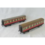 Two Bassett-Lowke tin plate O Guage passenger carriages, each with twin bogies.