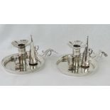 A pair of Georgian HM silver chambersticks, sliding mechanism to retract candle,