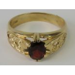 A 9ct gold and garnet ring,