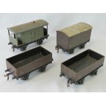 A quantity of four Bassett-Lowke O gauge tin plate wagons being two open,