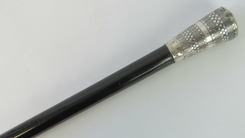 A Victorian HM silver topped ebonised walking cane bearing London marks and measuring 3' (92cm) in