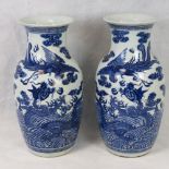 A matched pair of impressive late 19th/early 20th century Chinese blue and white vases,