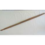 An early 20th century, tribal bamboo bow; overall length 129.5cm.