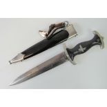 A WWII German SS Officers dagger in scabbard, made by Eikhorn, with inscribed blade.