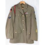 A Re-enactment reproduction WWII US armoured division tunic with badges and medal ribbon bar;