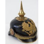 A German WWI style army Imperial Officers pickelhaube helmet with articulated chin strap,