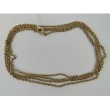 A long 9ct gold fancy link chain, 141cm in length, 27g.