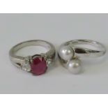 Two silver rings, one set with two grey/white pearls, size O-P,