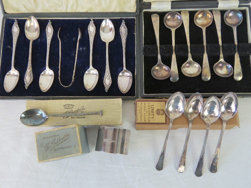 A hallmarked silver teaspoon and a HM silver napkin ring within original box, total 1.2ozt.