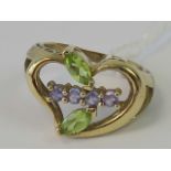 A 9ct gold heart shaped ring with leaf design in peridot and amethyst, hallmarked 375, size N, 4.