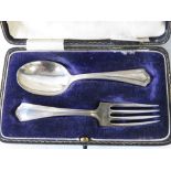 A HM silver childs fork and spoon set within original fitted box,