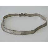 A white metal collerette, snake link with Greek key design, 39cm long.