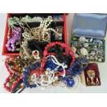 A large quantity of vintage and modern costume jewellery including charm bracelet, earrings, ring,