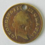 A 22ct gold 1800 George III third guinea, drilled hole to top, 2.