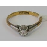 An 18ct gold and platinum diamond solitaire ring, round brilliant cut diamond approx 0.