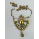 A 9ct gold and peridot Art Nouveau necklace, chain a/f, stamped 9ct, 2cm wide, 1.