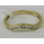 A 18ct gold and diamond half eternity wishbone style ring, total 0.