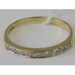 A 9ct gold half eternity diamond ring,