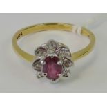 An 14ct gold ruby and diamond ring,